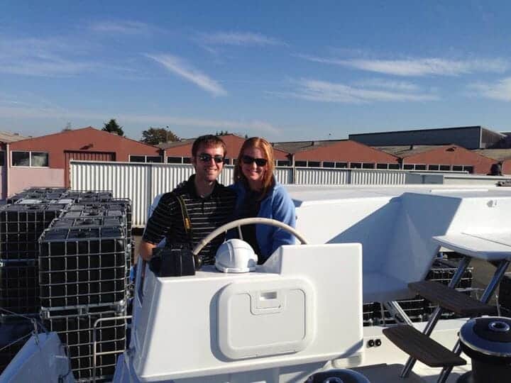 Amy and David at the helm of their new Fountaine Pajot catamaran.